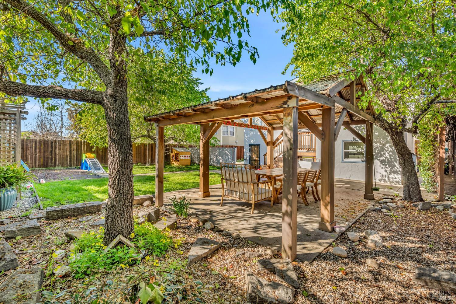 729 First Street Rodeo, CA 94572 - Photo 32 of 35 a backyard of a house with table and chairs