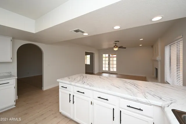 a bathroom with a sink a vanity and a mirror