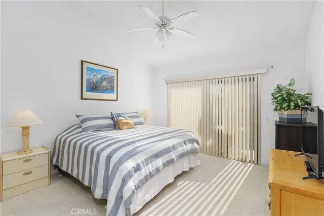 a bedroom with bed and a window