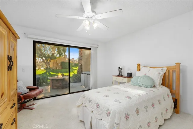 a bedroom with a large bed and a large window