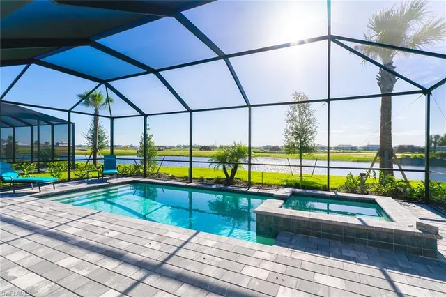 a view of swimming pool with seating area