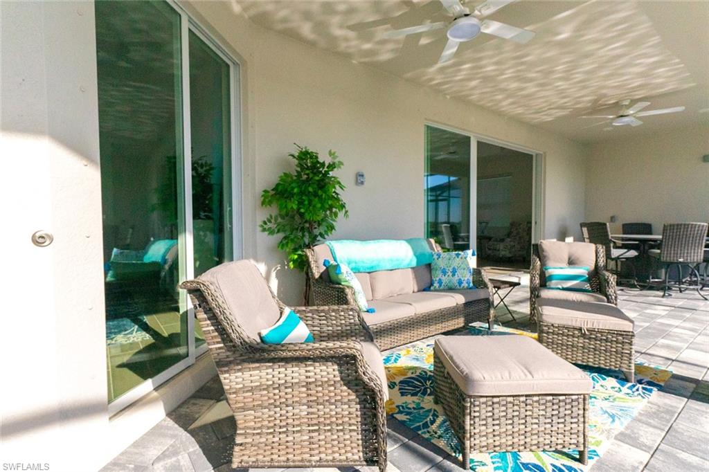 5534 Hampton Links Court Ave Maria, FL 34142 - Photo 28 of 50 a outdoor space with patio the couches and a potted plant on the table