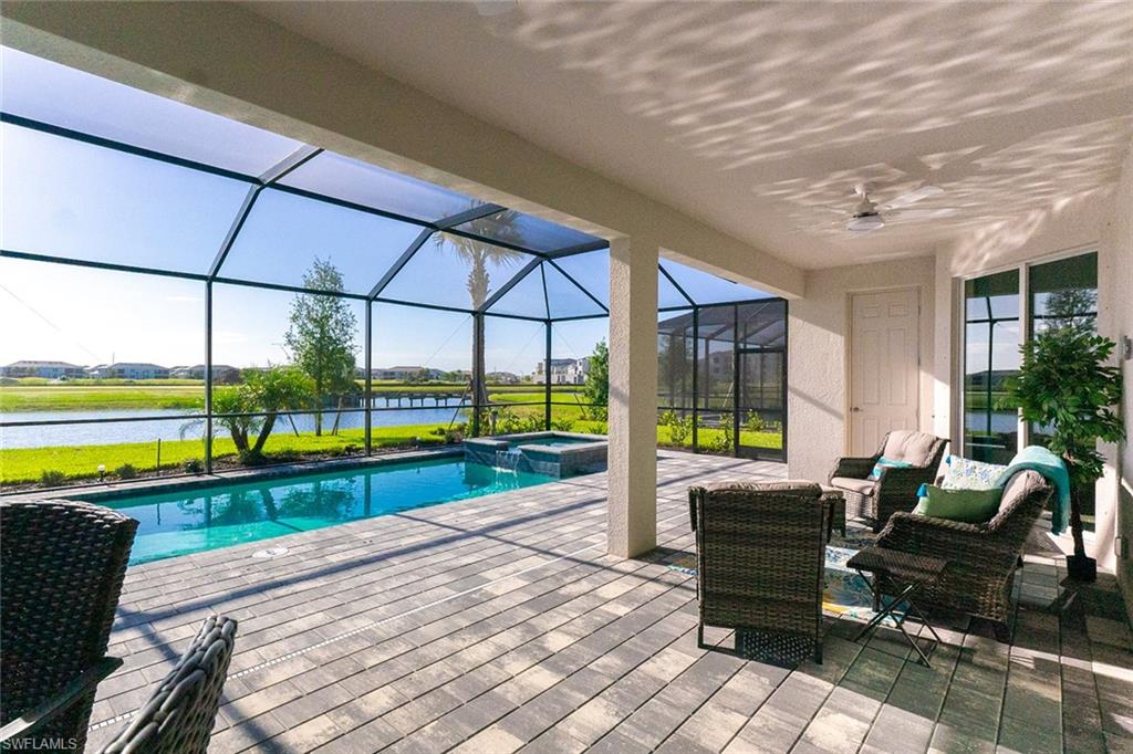 5534 Hampton Links Court Ave Maria, FL 34142 - Photo 30 of 50 a building outdoor space with patio furniture and swimming pool