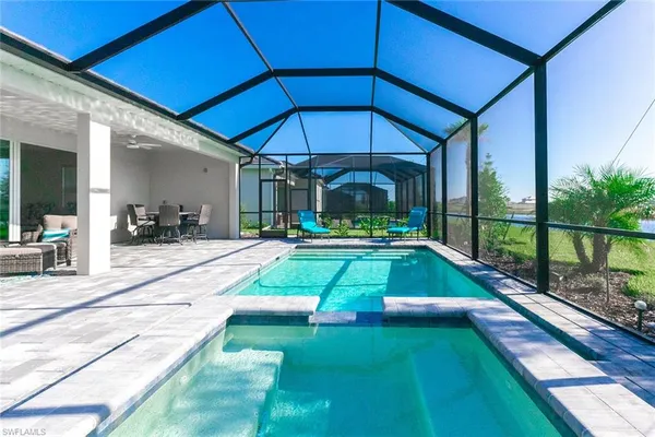 a view of swimming pool with a patio