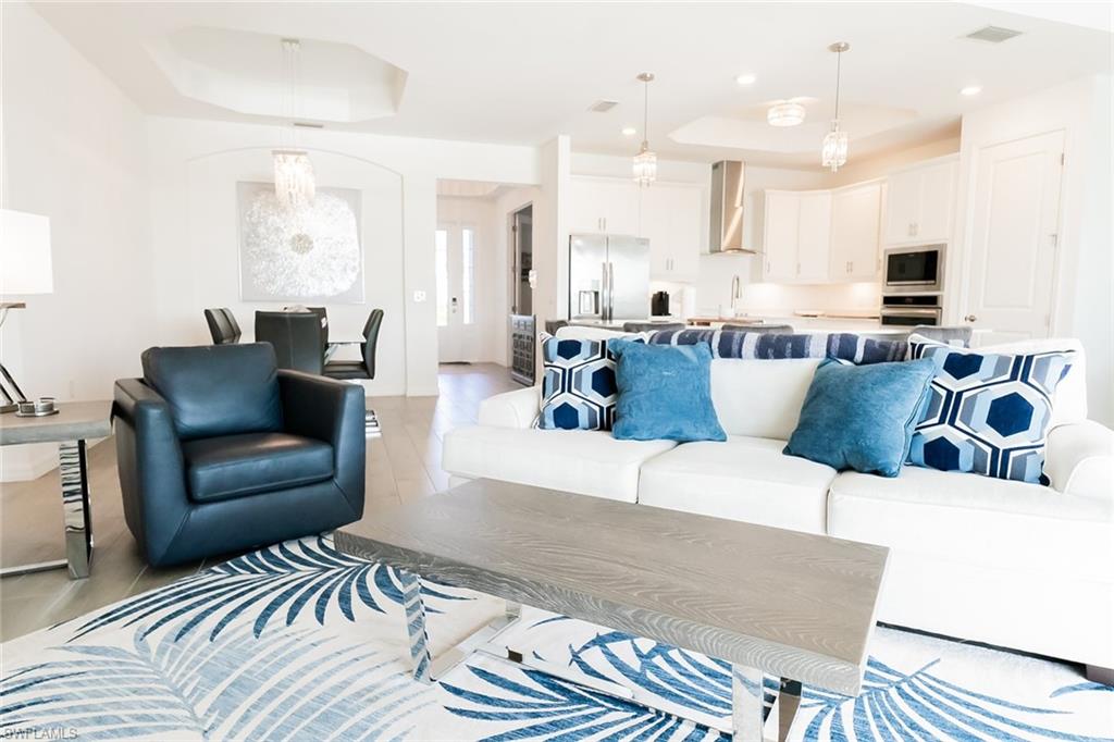 5534 Hampton Links Court Ave Maria, FL 34142 - Photo 9 of 50 a living room with furniture and a couch