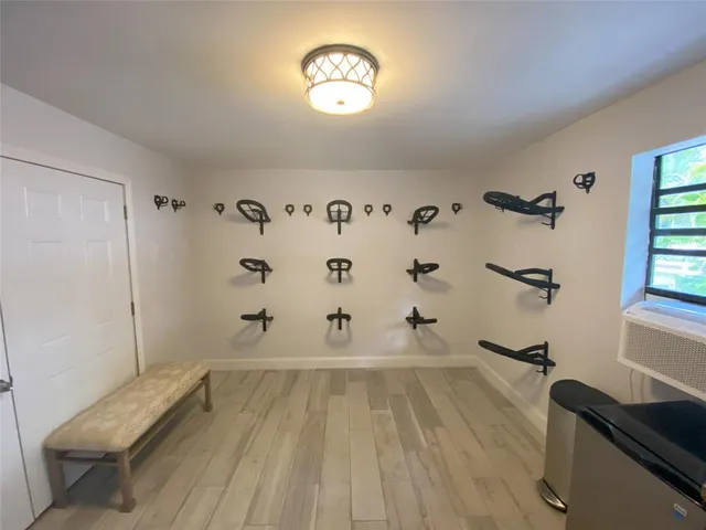 a view of a hardwood floor and staircase