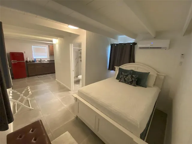 a bedroom with a bed and a cabinets