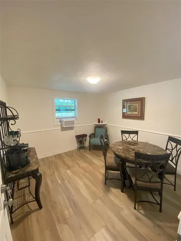 a workspace with furniture and wooden floor