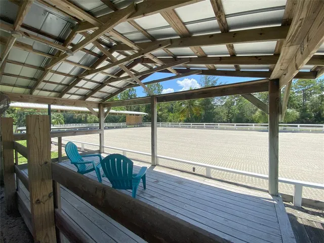 a view of a balcony with wooden floor