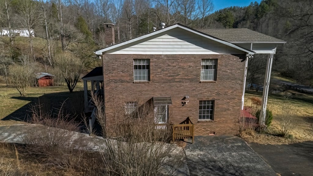 200 Mt Liberty Road McCaysville, GA 30555 - Photo 21 of 26 a front view of a house with a yard