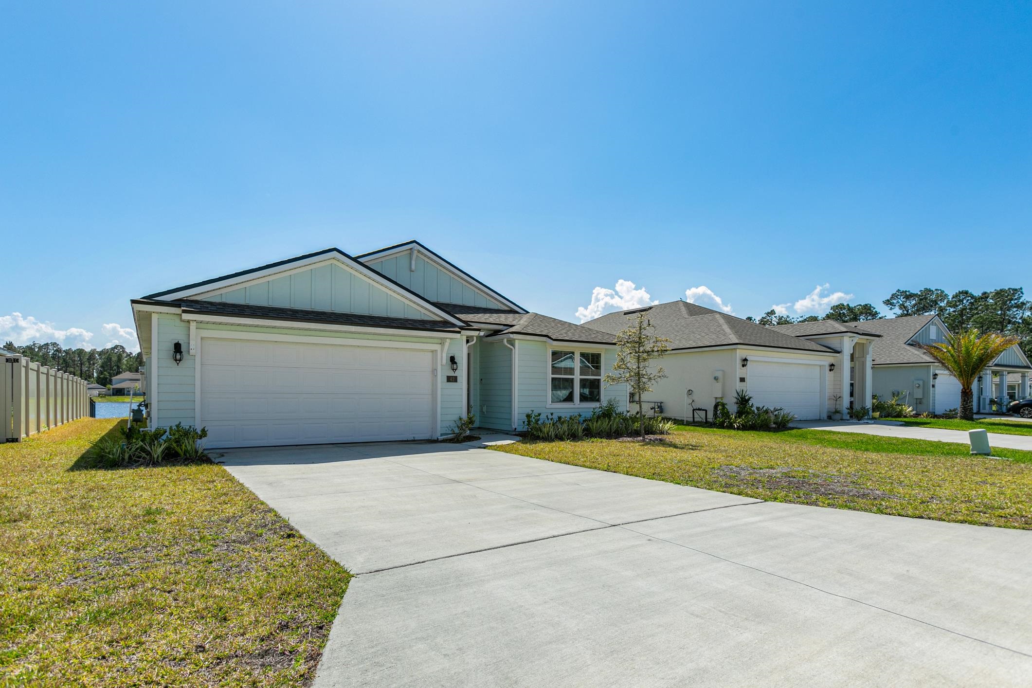 42 Huesca Court St. Augustine, FL 32084 - Photo 1 of 70 a front view of a house with a yard and garage