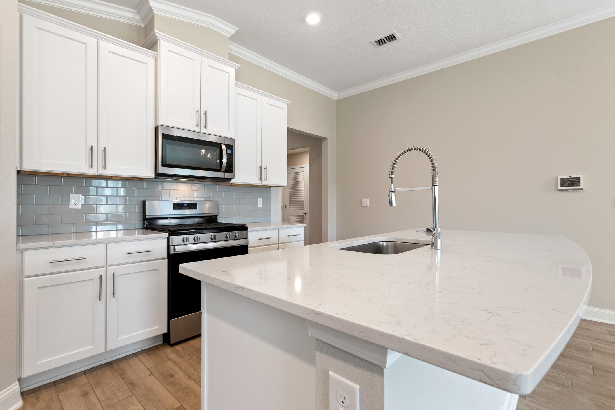 42 Huesca Court St. Augustine, FL 32084 - Photo 14 of 70 a kitchen with stainless steel appliances a sink a stove and microwave
