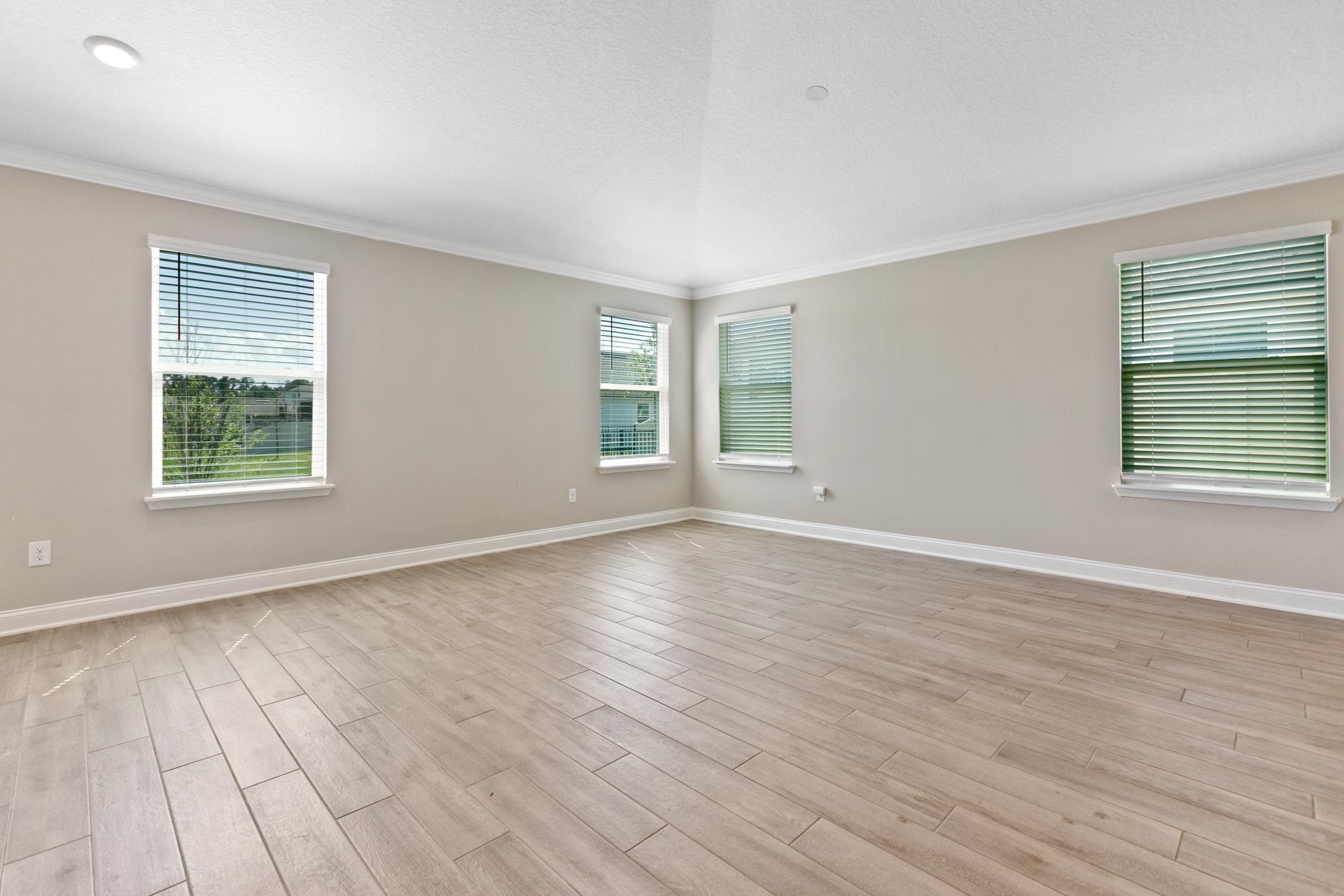 42 Huesca Court St. Augustine, FL 32084 - Photo 21 of 70 an empty room with wooden floor and windows