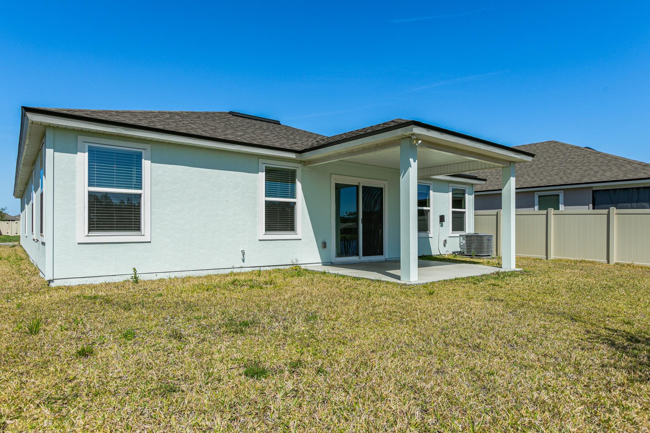 42 Huesca Court St. Augustine, FL 32084 - Photo 43 of 70 a front view of a house with a garden