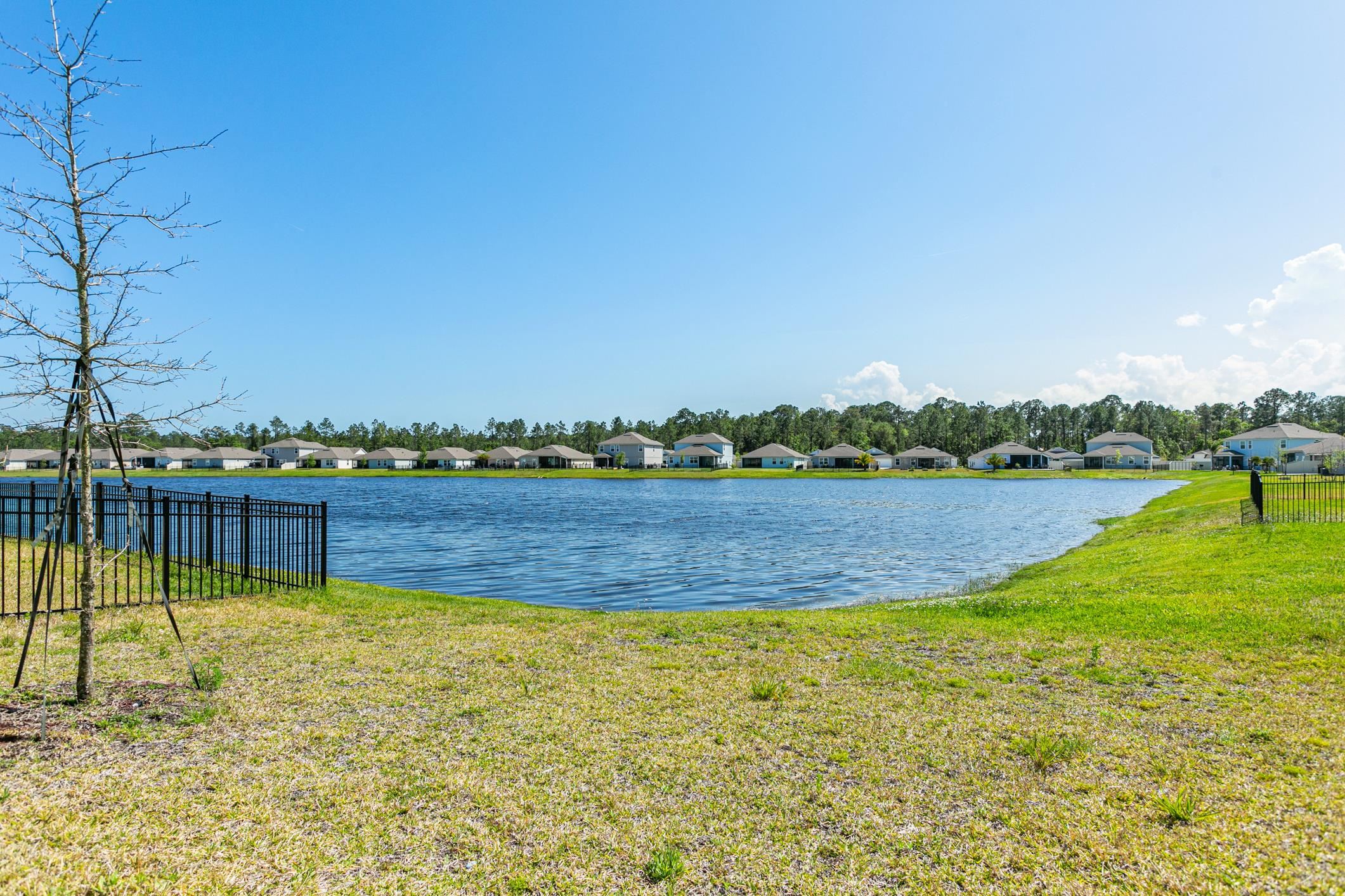 42 Huesca Court St. Augustine, FL 32084 - Photo 44 of 70 a view of a lake with houses in the back