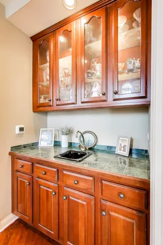 a living room with furniture a fireplace and a potted plant