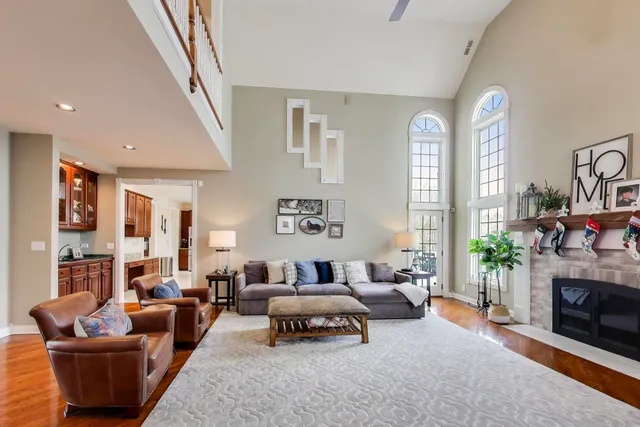 a view of a kitchen with a sink dishwasher and a fireplace