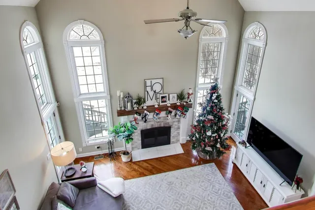 a view of a livingroom with furniture and hardwood floor