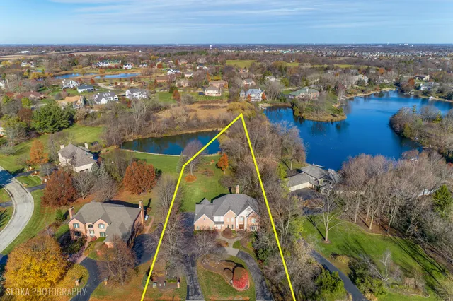an aerial view of a house with a ocean view