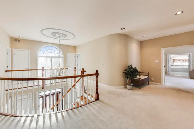 a spacious bathroom with a double vanity sink mirror and shower