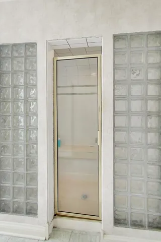 a bedroom with a bed and cabinets