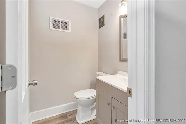 a bathroom with a toilet a sink and shower