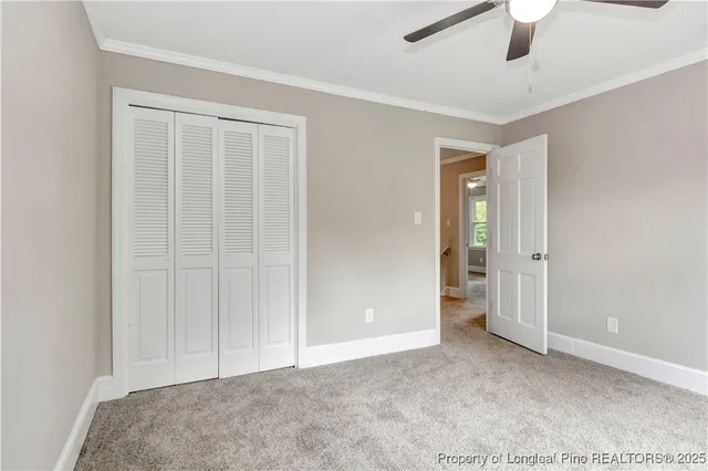 an empty room with closet area