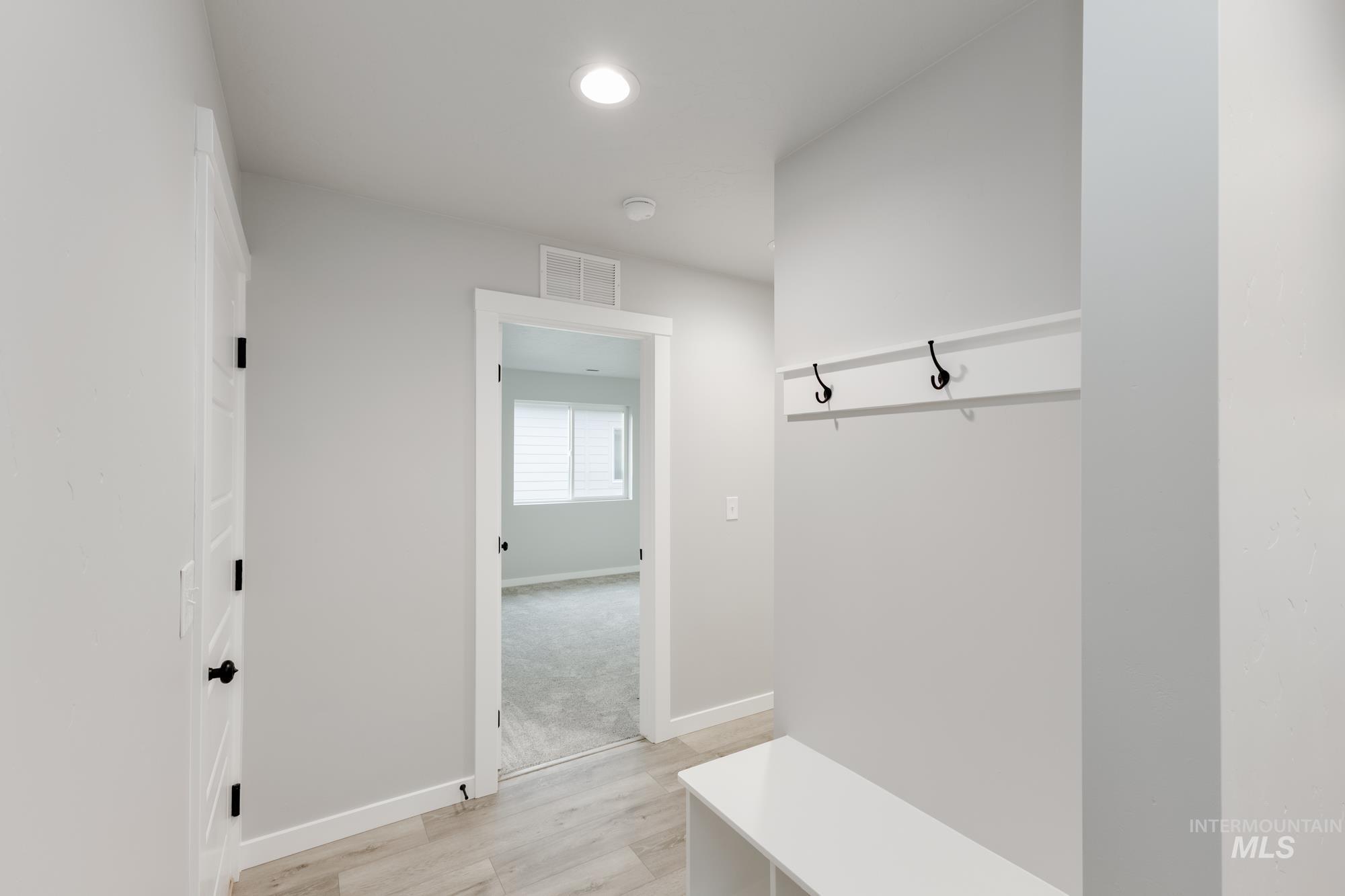 907 North Aleppo Way Meridian, ID 83642 - Photo 13 of 19 Mudroom featuring light wood-type flooring and recessed lighting