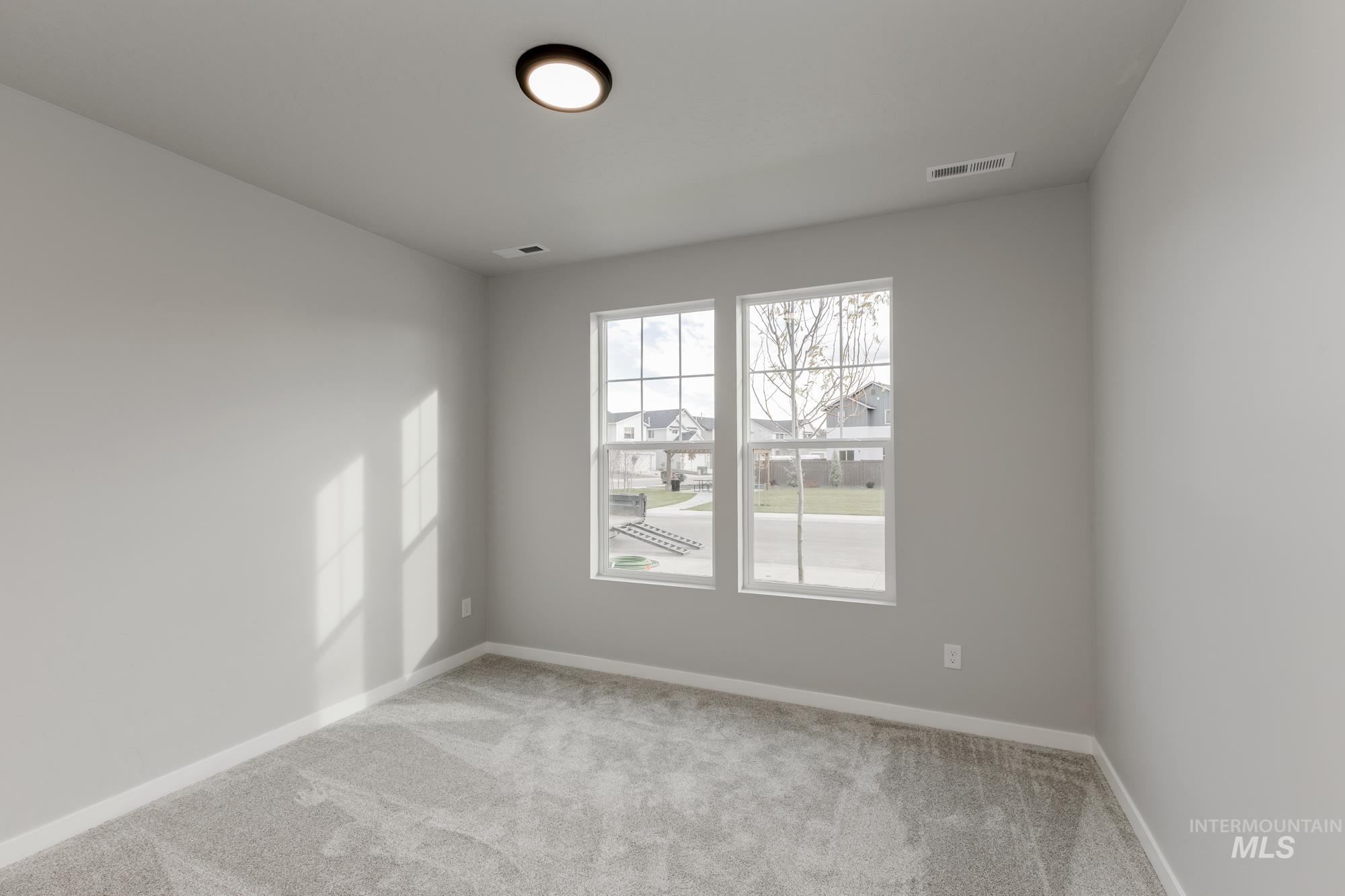 907 North Aleppo Way Meridian, ID 83642 - Photo 10 of 19 Carpeted spare room with baseboards
