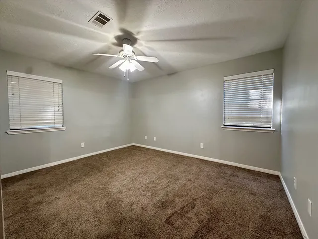 en view of an empty room with a window