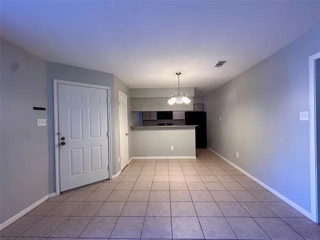 a view of a kitchen with a sink and a stove top oven
