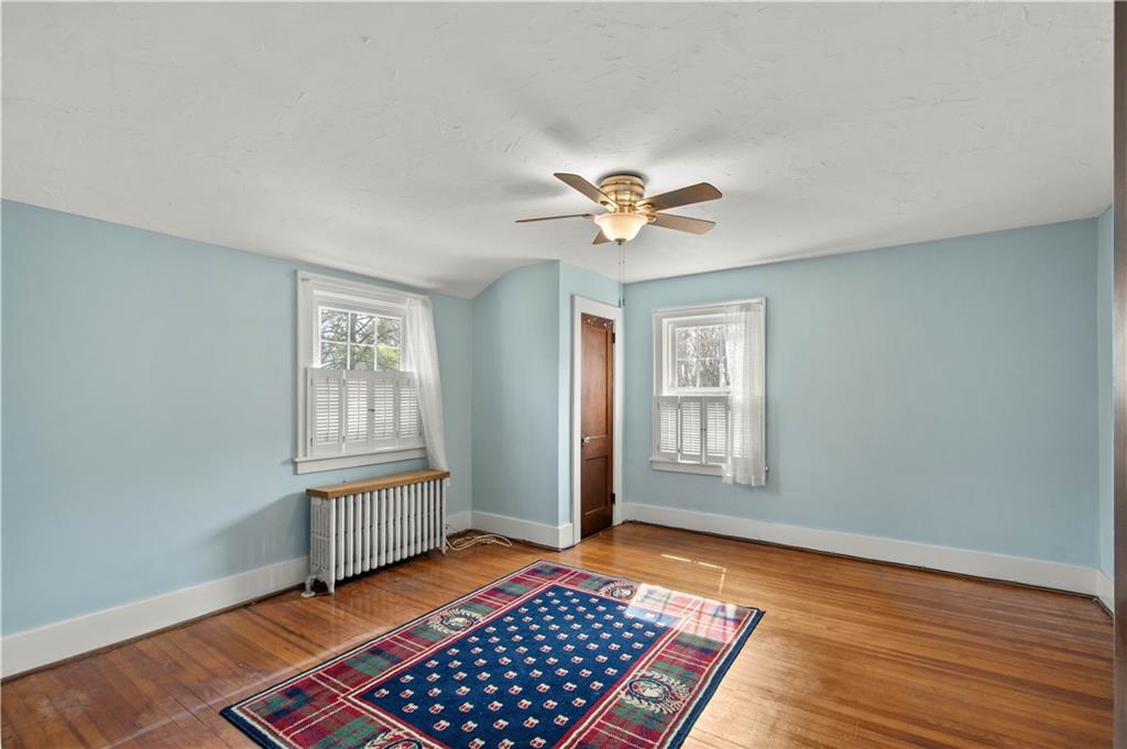 705 Walnut Street Crescent, PA 15046 - Photo 24 of 41 a view of an empty room with a window and wooden floor