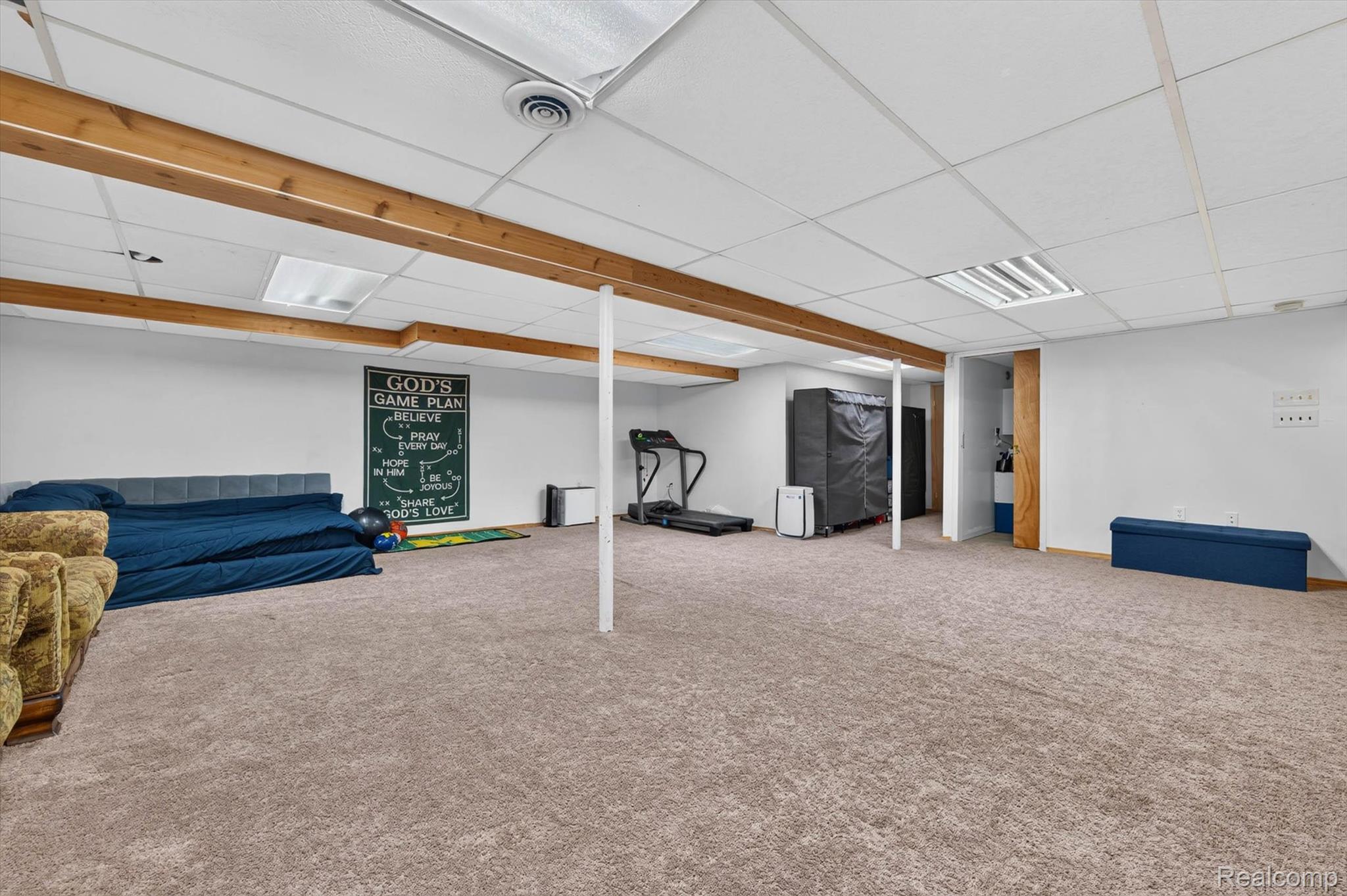 46362 Springhill Drive Utica, MI 48317 - Photo 32 of 59 Spacious lower level featuring light brown carpeting, exposed wood beams, and recessed lighting