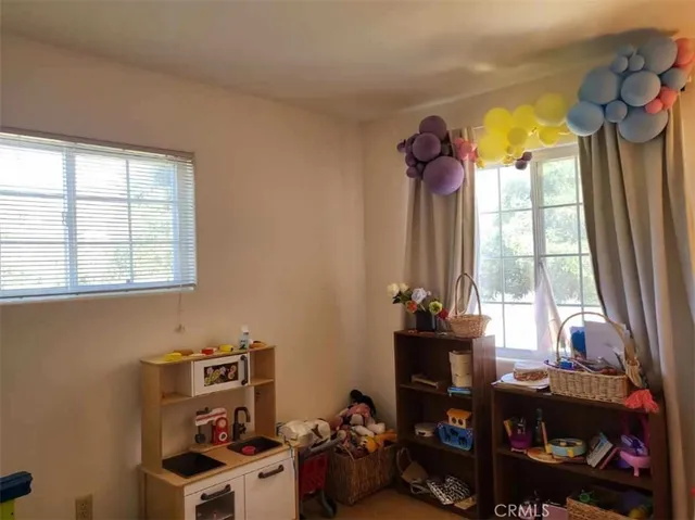 a room with a window and toys