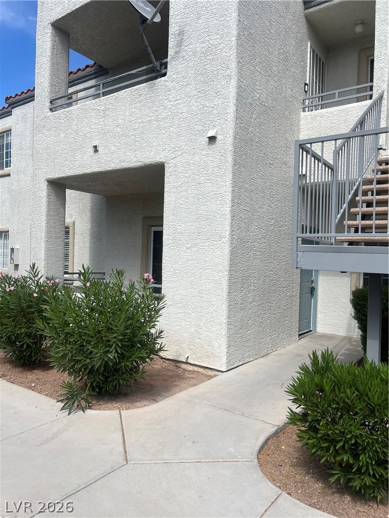 3318 North Decatur Boulevard, Unit 1174 Las Vegas, NV 89130 - Photo 1 of 23 This multi-story residential building features inviting balconies and convenient exterior stair access.