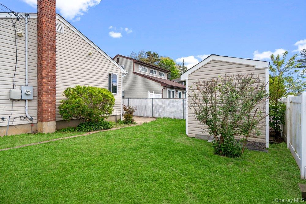 101 Sexton Road West Babylon, NY 11704 - Photo 30 of 33 a view of a house with a big yard and potted plants