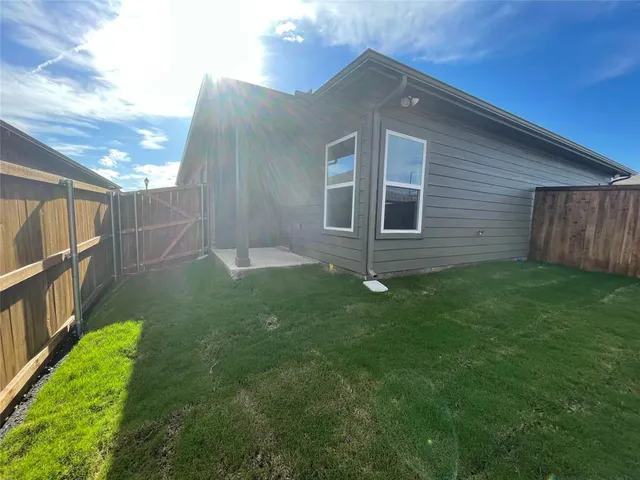 a backyard of a house with lots of green space