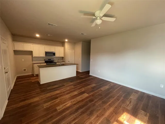 a view of kitchen with wooden floor