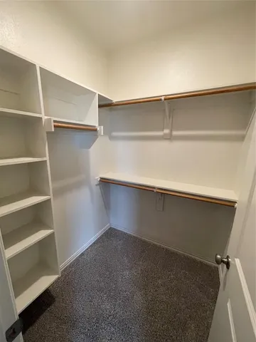 a view of an empty walk in closet
