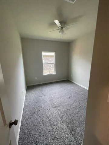 an empty room with a empty space and windows