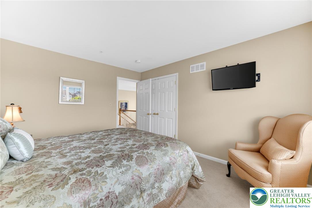 5440 Spring Ridge Drive West Macungie, PA 18062 - Photo 26 of 40 A restful bedroom with ample natural light offers a comfortable retreat for relaxation.