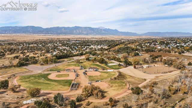 212 South Reed Street Fountain, CO 80817 - Photo 13 of 13 Aerial view of property and surrounding area with a mountain backdrop