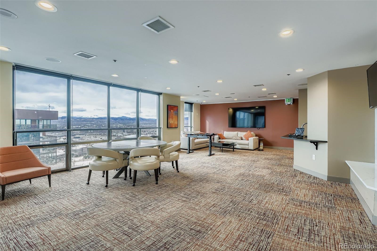 1625 Larimer Street, Unit 602 Denver, CO 80202 - Photo 18 of 22 a living room with furniture and a large window