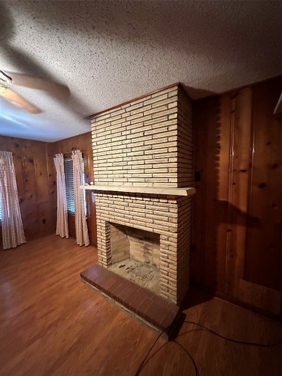 2221 South Front Street Angleton, TX 77515 - Photo 12 of 26 a living room with furniture and a fireplace