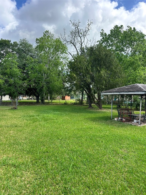 2221 South Front Street Angleton, TX 77515 - Photo 17 of 26 a view of outdoor space with deck and yard