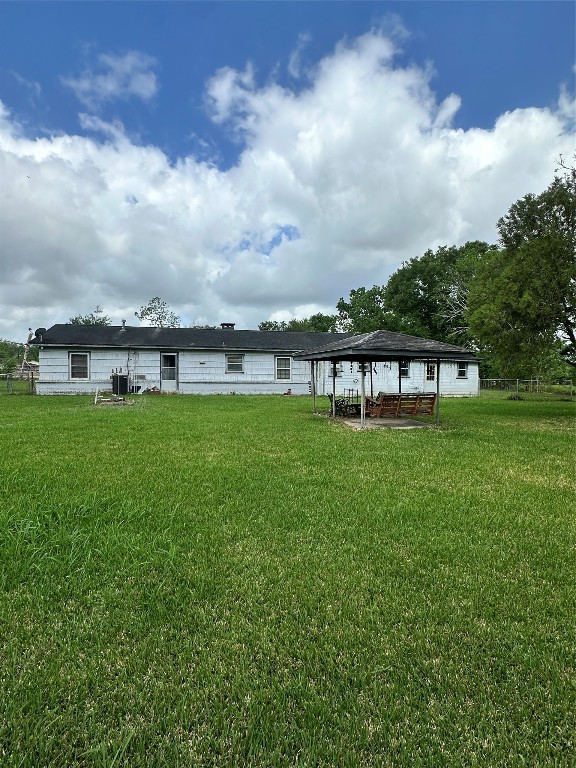 2221 South Front Street Angleton, TX 77515 - Photo 20 of 26 a view of a big yard with table and chairs