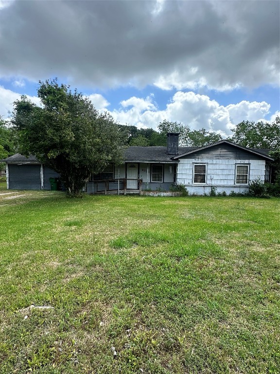 2221 South Front Street Angleton, TX 77515 - Photo 26 of 26 a view of a house with a yard and sitting area