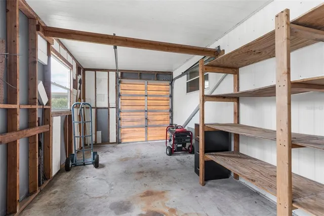 a view of a white house with a yard