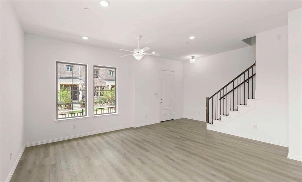 633 Blue Rdg Drive Mansfield, TX 76063 - Photo 3 of 17 a view of an empty room with wooden floor and a window