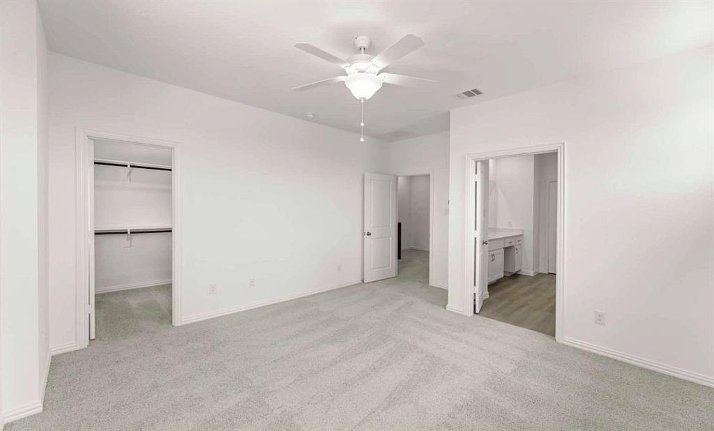 633 Blue Rdg Drive Mansfield, TX 76063 - Photo 10 of 17 an empty room with closet and a ceiling fan